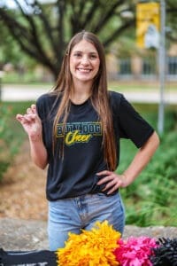 Current Student giving "pups up" sign