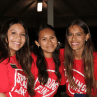 A group of TLU women in matching red shirts