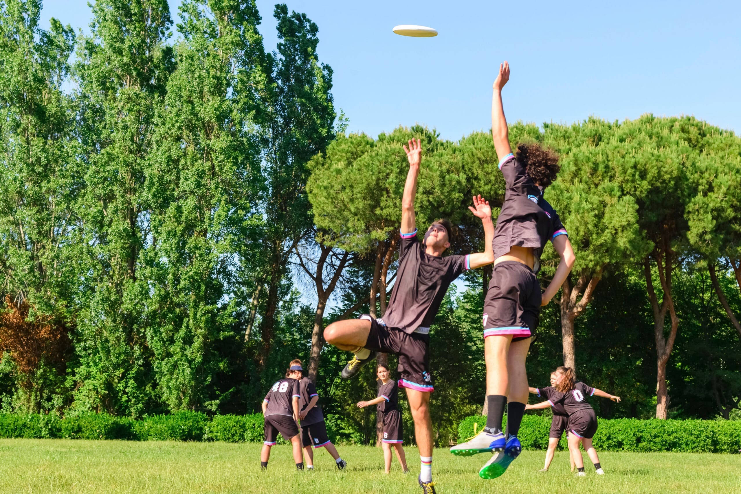Students playing frisbee football