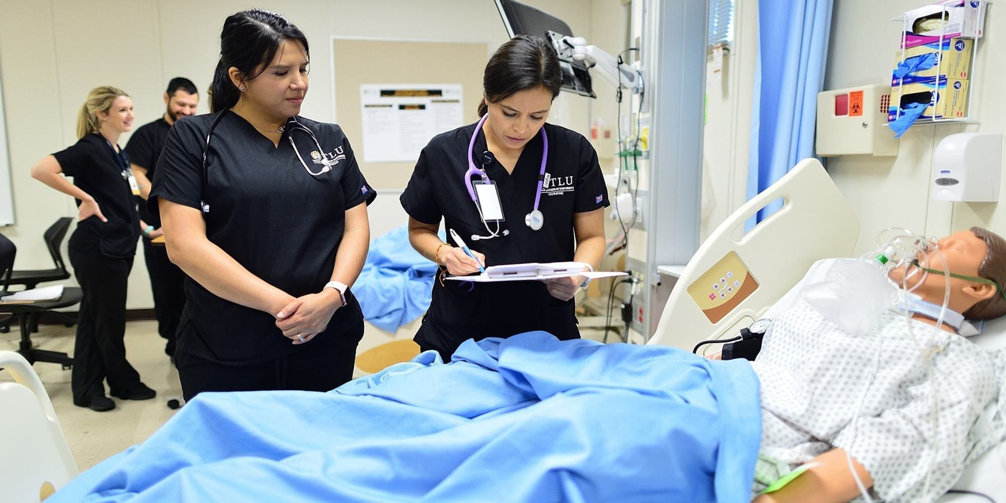 two nursing students in lab