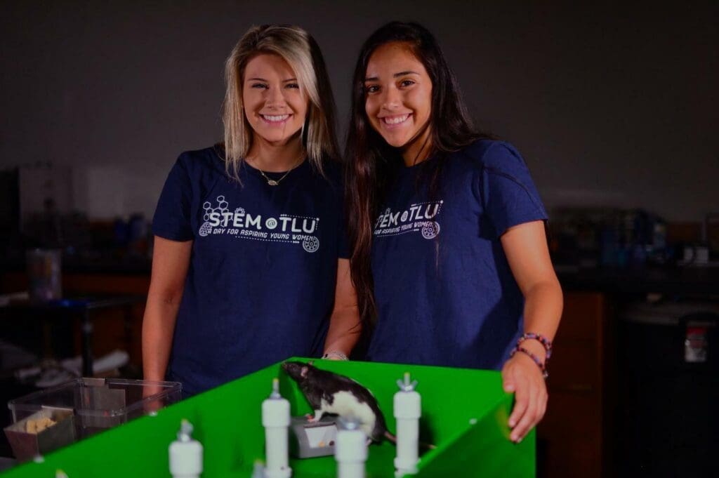 Two students with rat