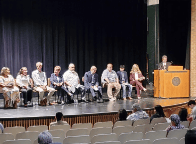 community panel on stage in wupperman