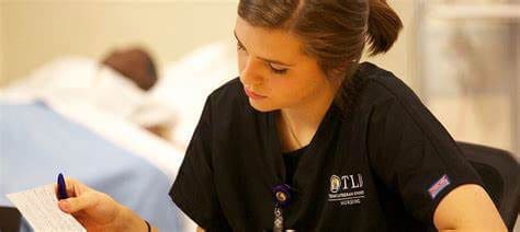 student in lab looking at papers